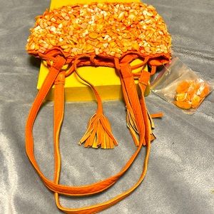 Small orange bag 5 inches long x 8 inches wide by Mouna